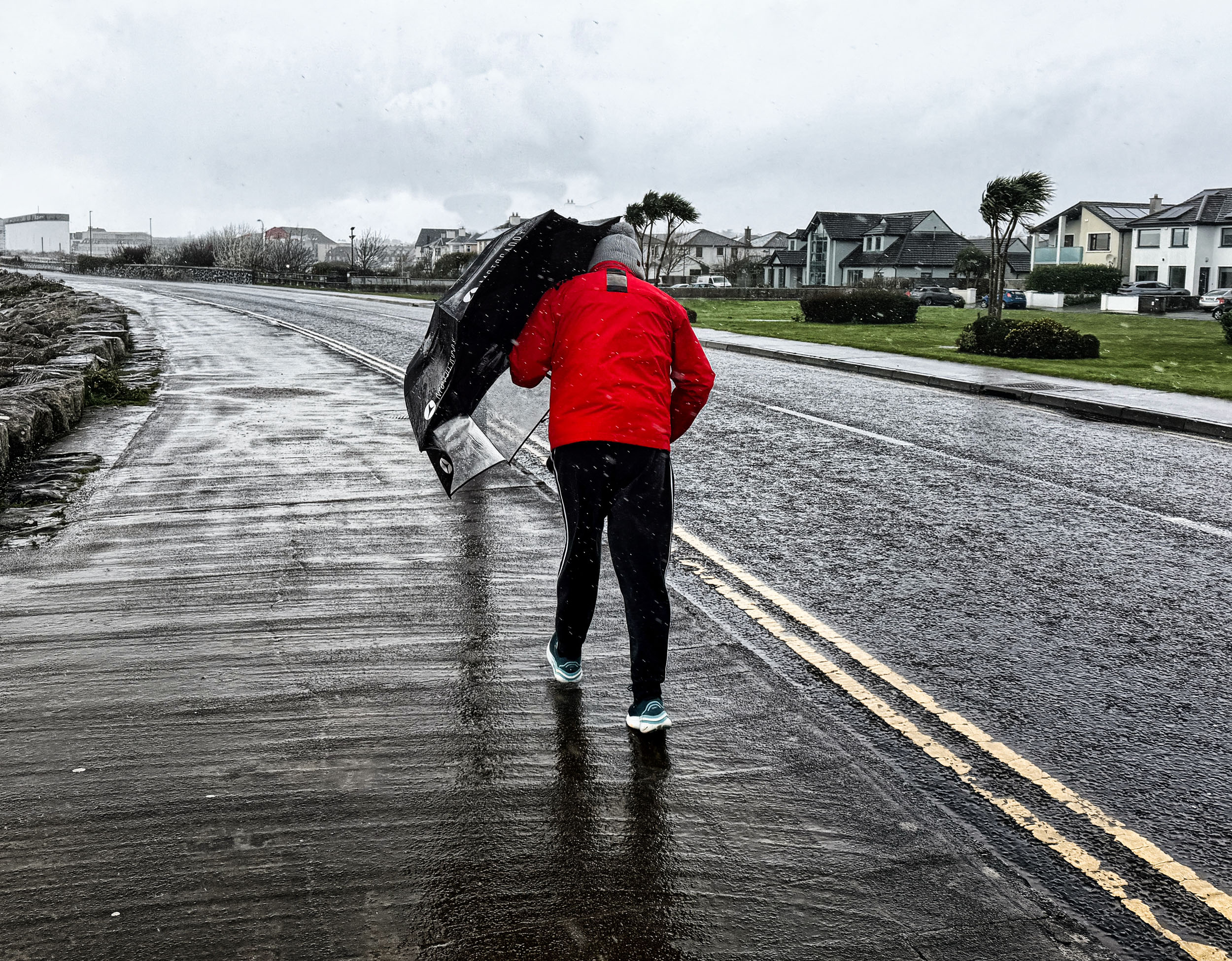 Wild Atlantic Way storm blasts pedestrian on Salthill Promenade, County Galway